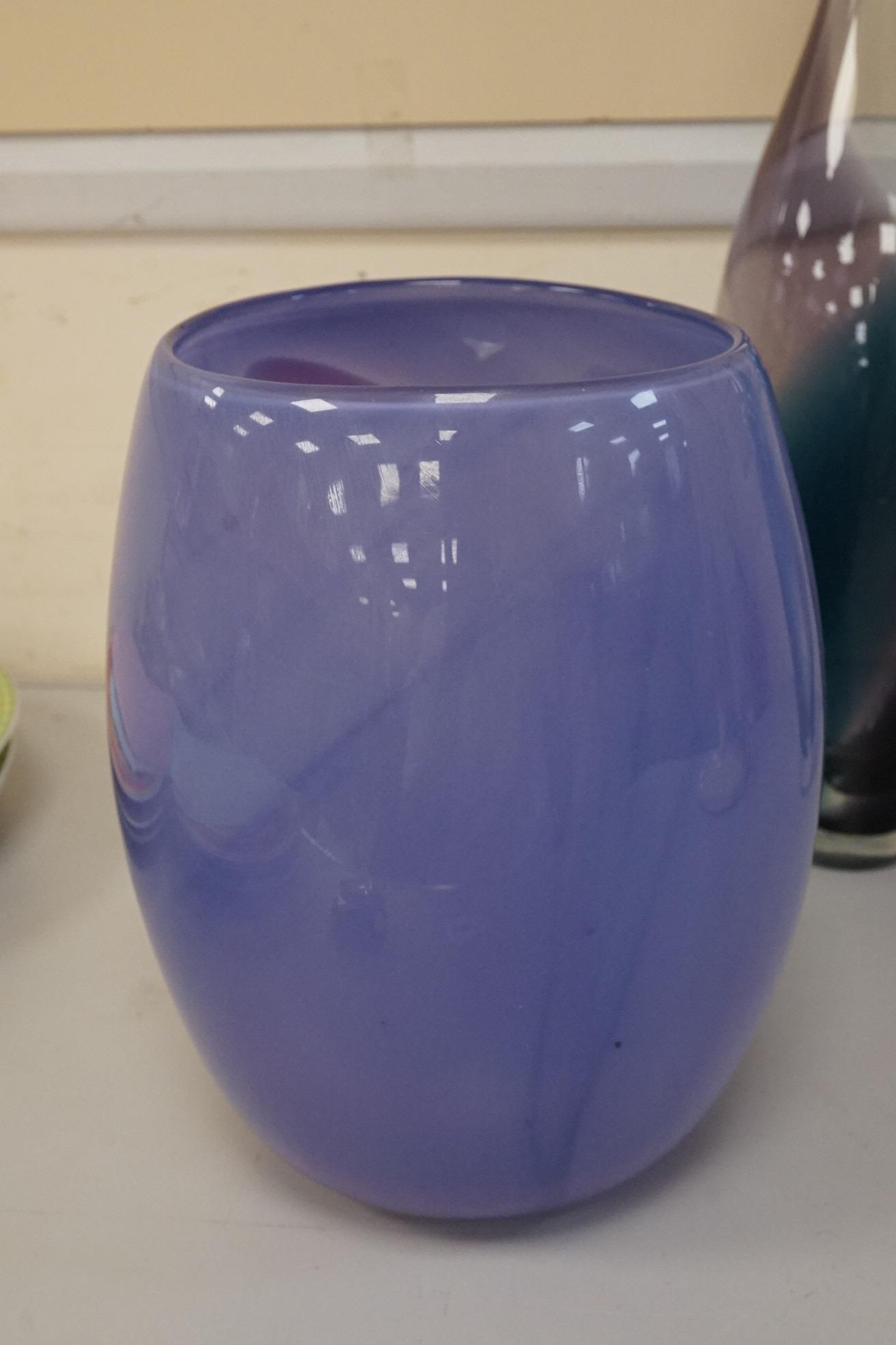 Three art glass vases to include a pair of purple and blue stem vases, 42cm high